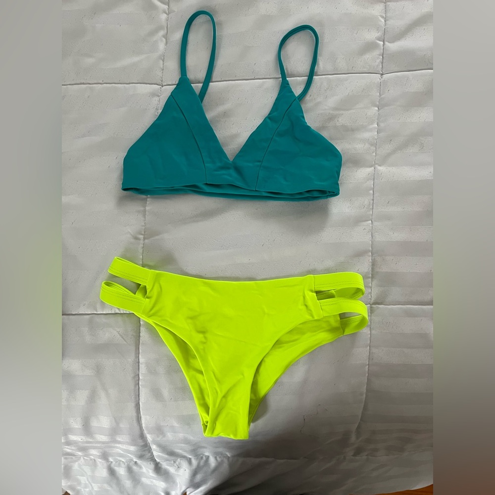 Kittenish Bikini top & yellow bottoms.